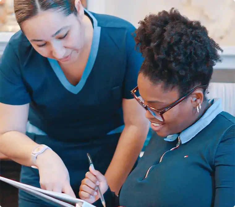 Staff assisting patients with insurance claims