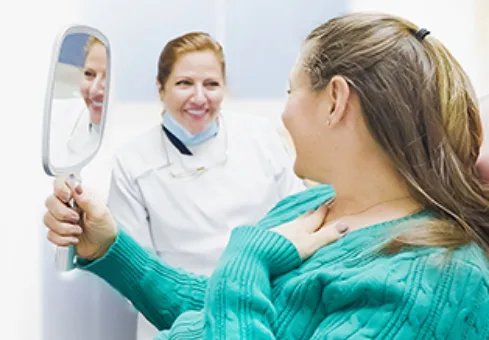 Dr. Irma Gavaldon revealing the smile of a patient
